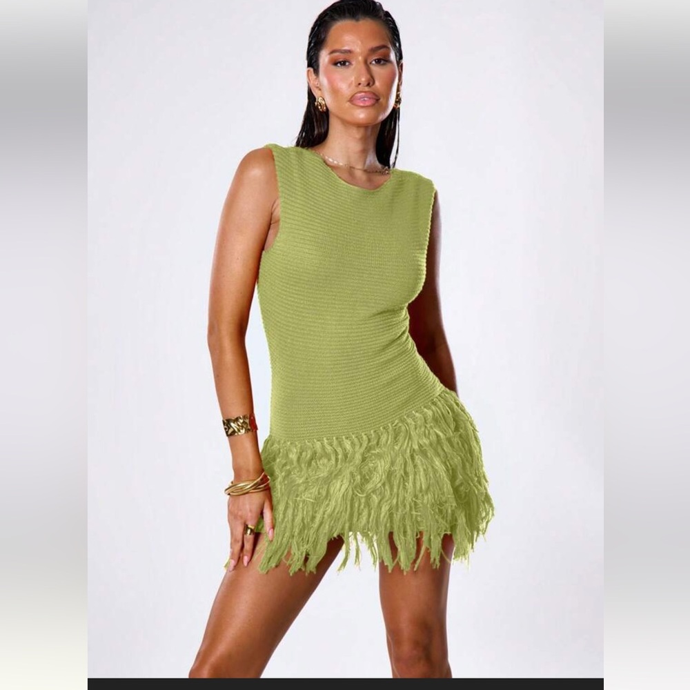Green knit sleeveless dress with tassel hem